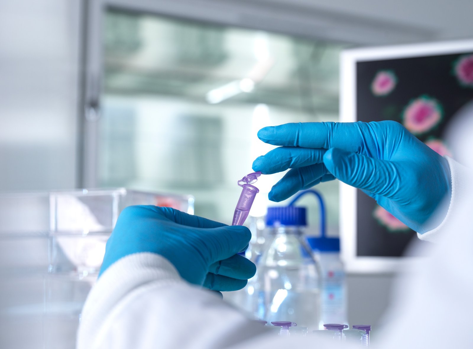 Pharmaceutical research, Scientist preparing a sample vial for analytical testing in the laboratory